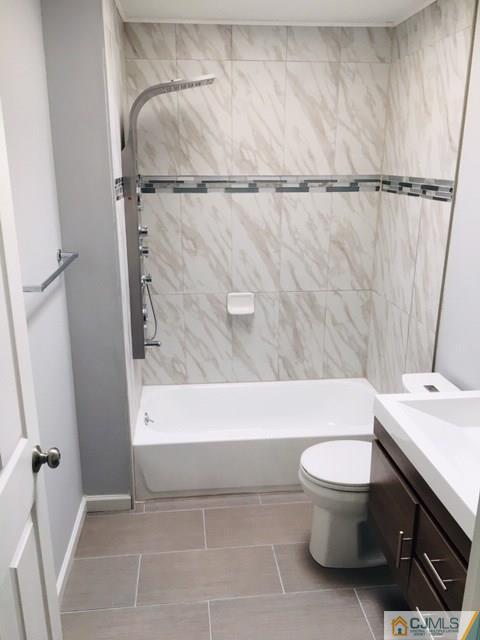 65 Old Post Road Edison, NJ 08817 - Photo 14 of 25 a bathroom with a sink a toilet and a bathtub