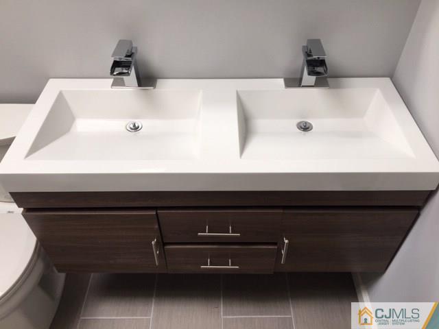 65 Old Post Road Edison, NJ 08817 - Photo 15 of 25 a bathroom with a sink and a mirror