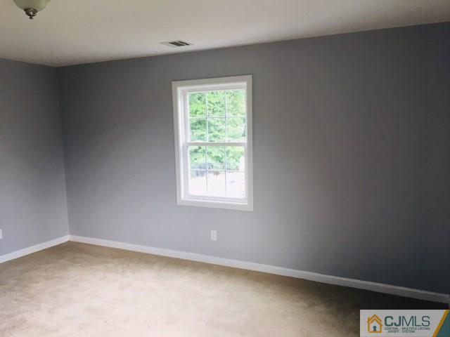 65 Old Post Road Edison, NJ 08817 - Photo 19 of 25 an empty room with a window