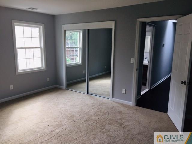 65 Old Post Road Edison, NJ 08817 - Photo 20 of 25 an empty room with windows and closet