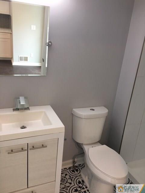65 Old Post Road Edison, NJ 08817 - Photo 8 of 25 a white toilet sitting next to a bathroom sink