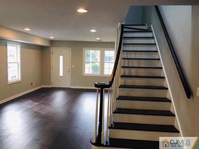 65 Old Post Road Edison, NJ 08817 - Photo 9 of 25 wooden floor in an empty room with stairs