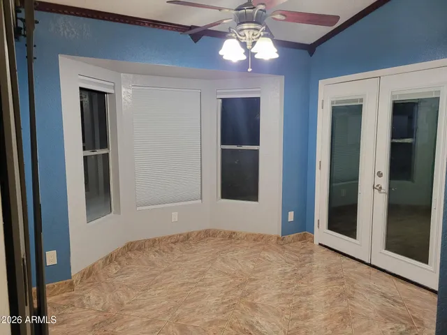 a view of a livingroom with a chandelier fan