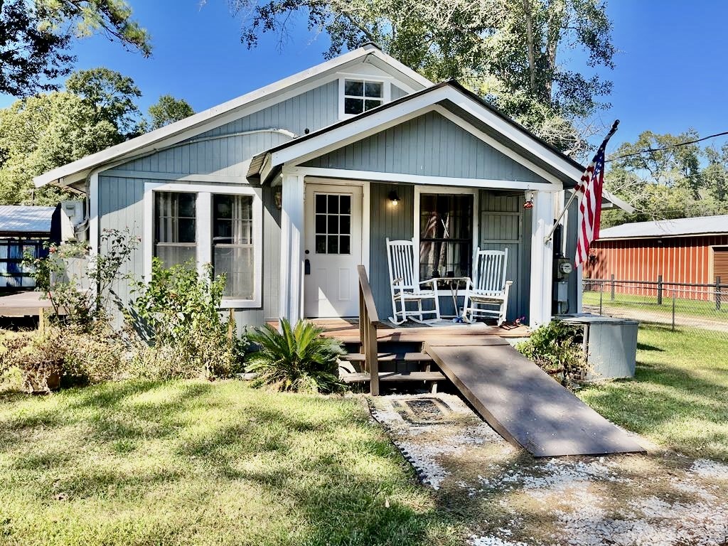 114 Elm Branch Street Huntington, TX 75949 - Photo 1 of 14 a front view of a house with garden