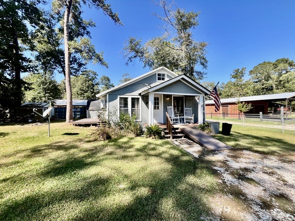 114 Elm Branch Street Huntington, TX 75949 - Photo 2 of 14 a view of a house with a yard patio and fire pit