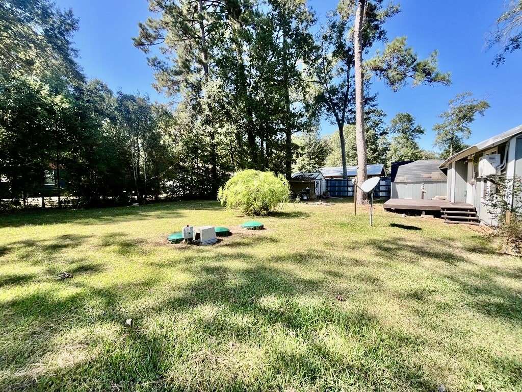 114 Elm Branch Street Huntington, TX 75949 - Photo 8 of 14 a view of swimming pool with seating area and trees around