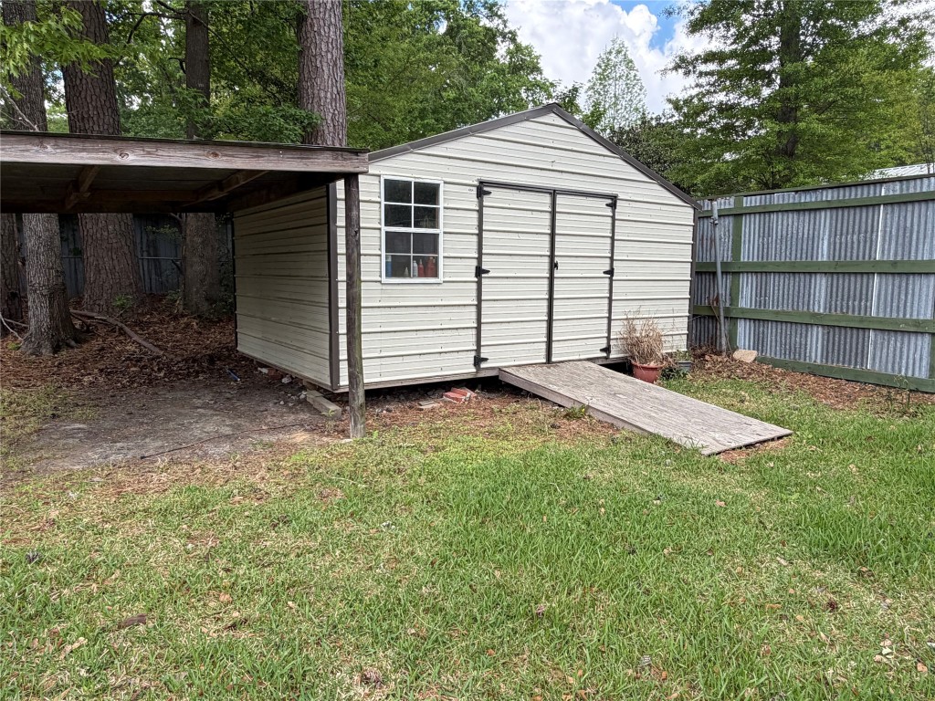114 Elm Branch Street Huntington, TX 75949 - Photo 10 of 14 a view of a house with a yard