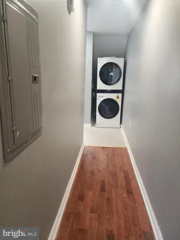 a view of a hallway with washer and dryer