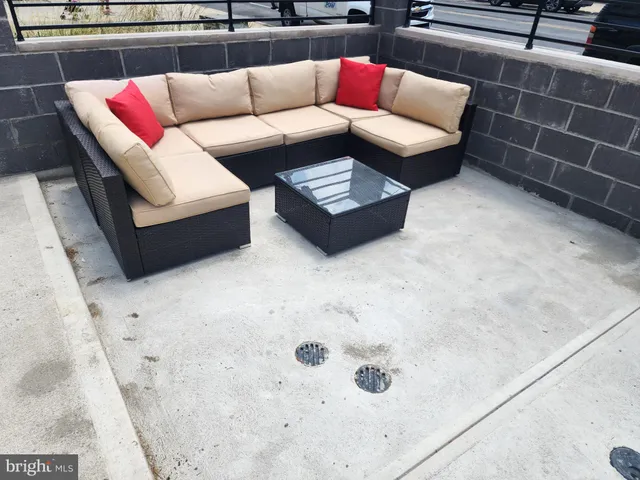 a living room with furniture and a rug