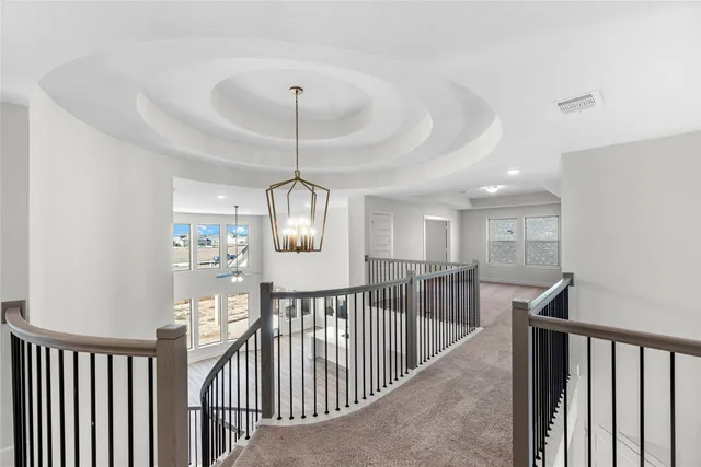 a view of a hallway with a chandelier