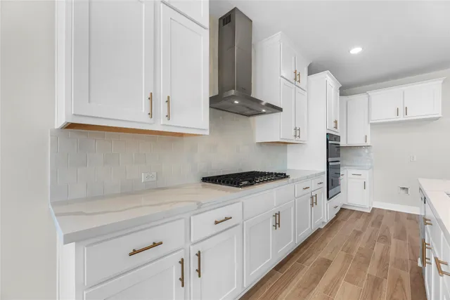 a kitchen with stainless steel appliances white cabinets and a sink
