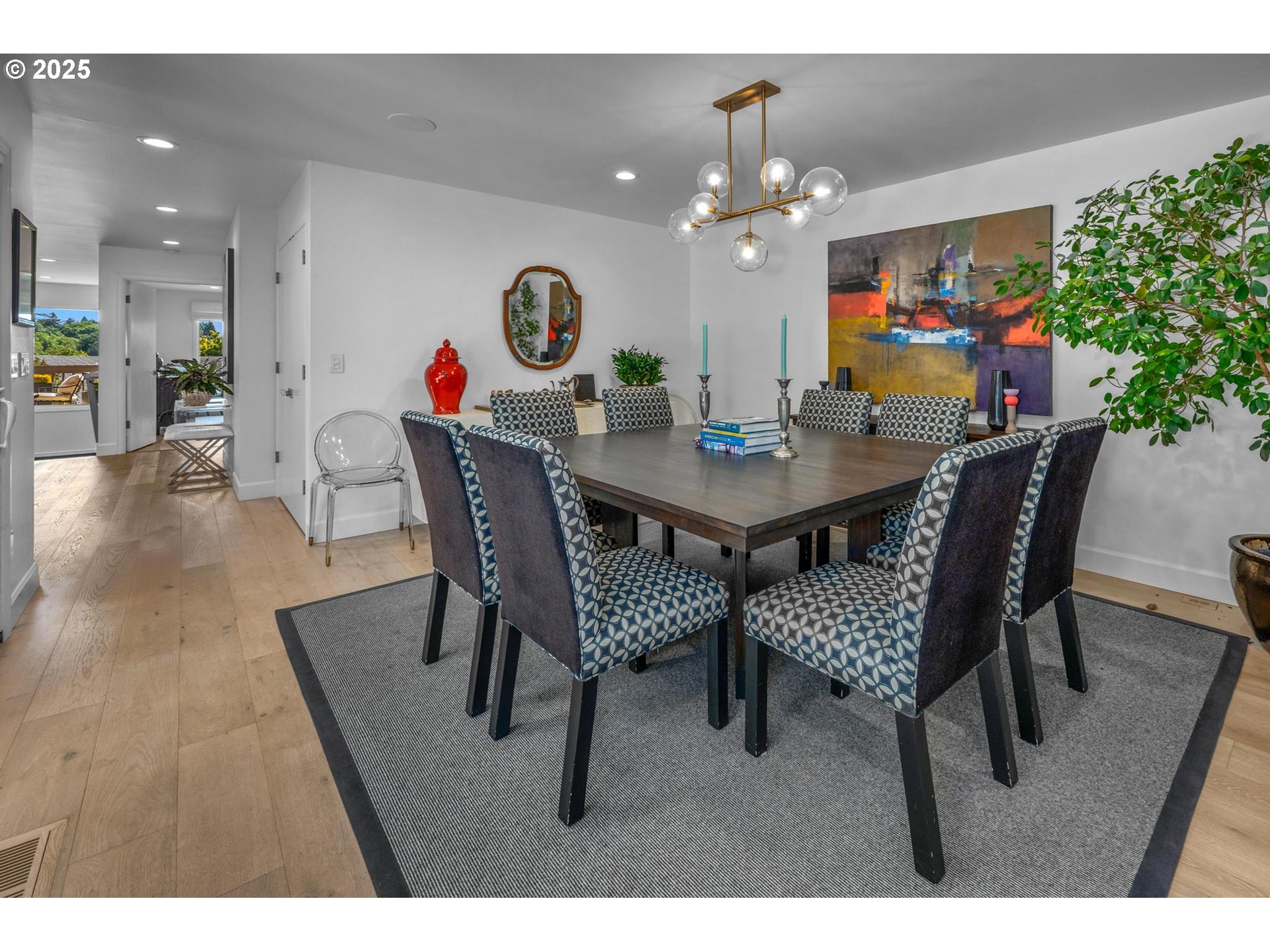 40 Southwest Condolea Court Lake Oswego, OR 97035 - Photo 11 of 39 a view of a dining room with furniture and wooden floor