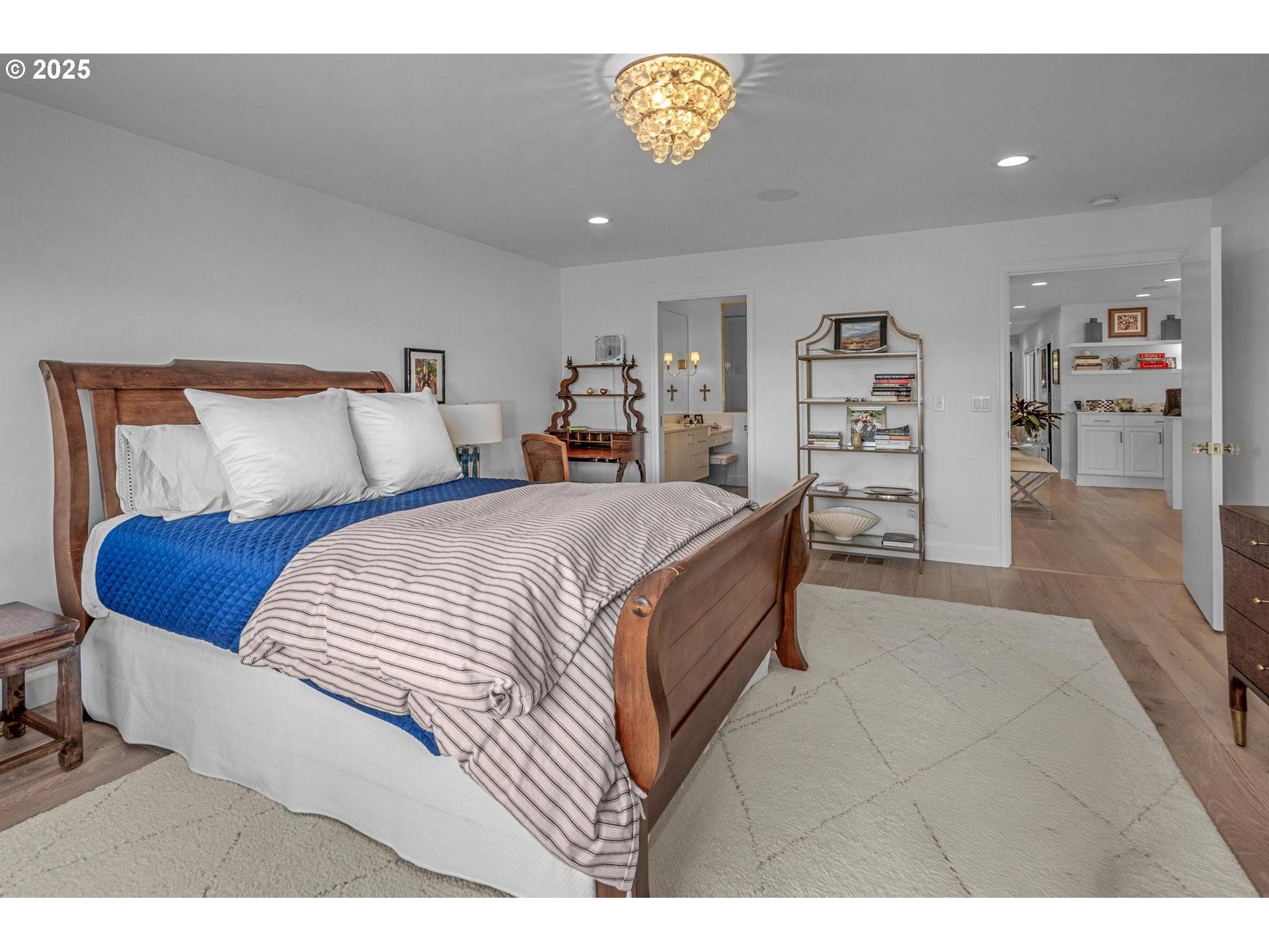 40 Southwest Condolea Court Lake Oswego, OR 97035 - Photo 14 of 39 a bedroom with a bed and a book shelf