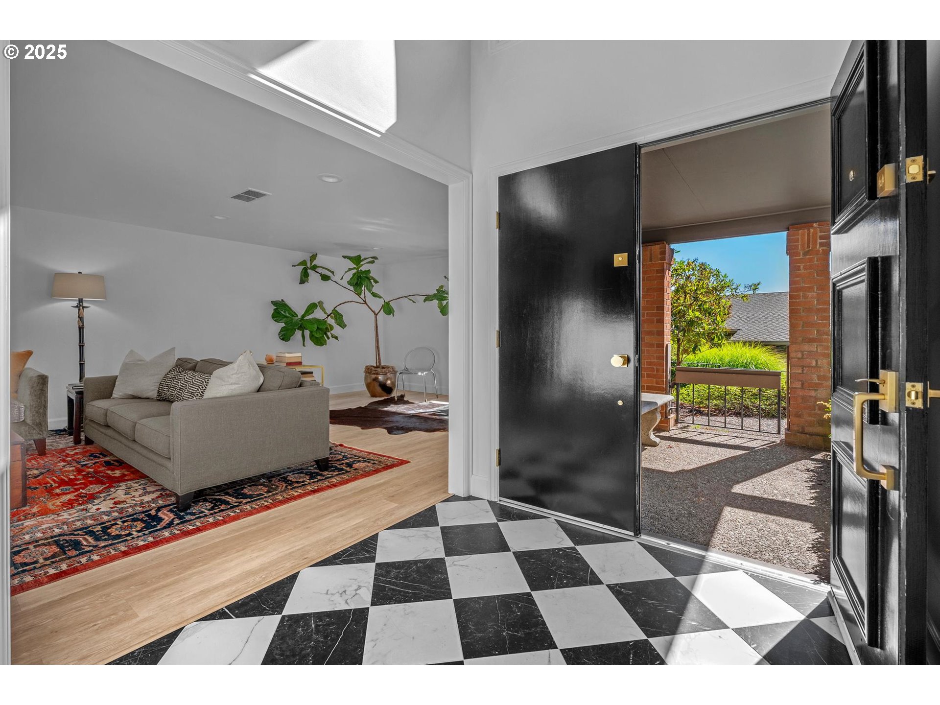 40 Southwest Condolea Court Lake Oswego, OR 97035 - Photo 15 of 39 a living room with a black white checkered floor with couches chair and a coffee table