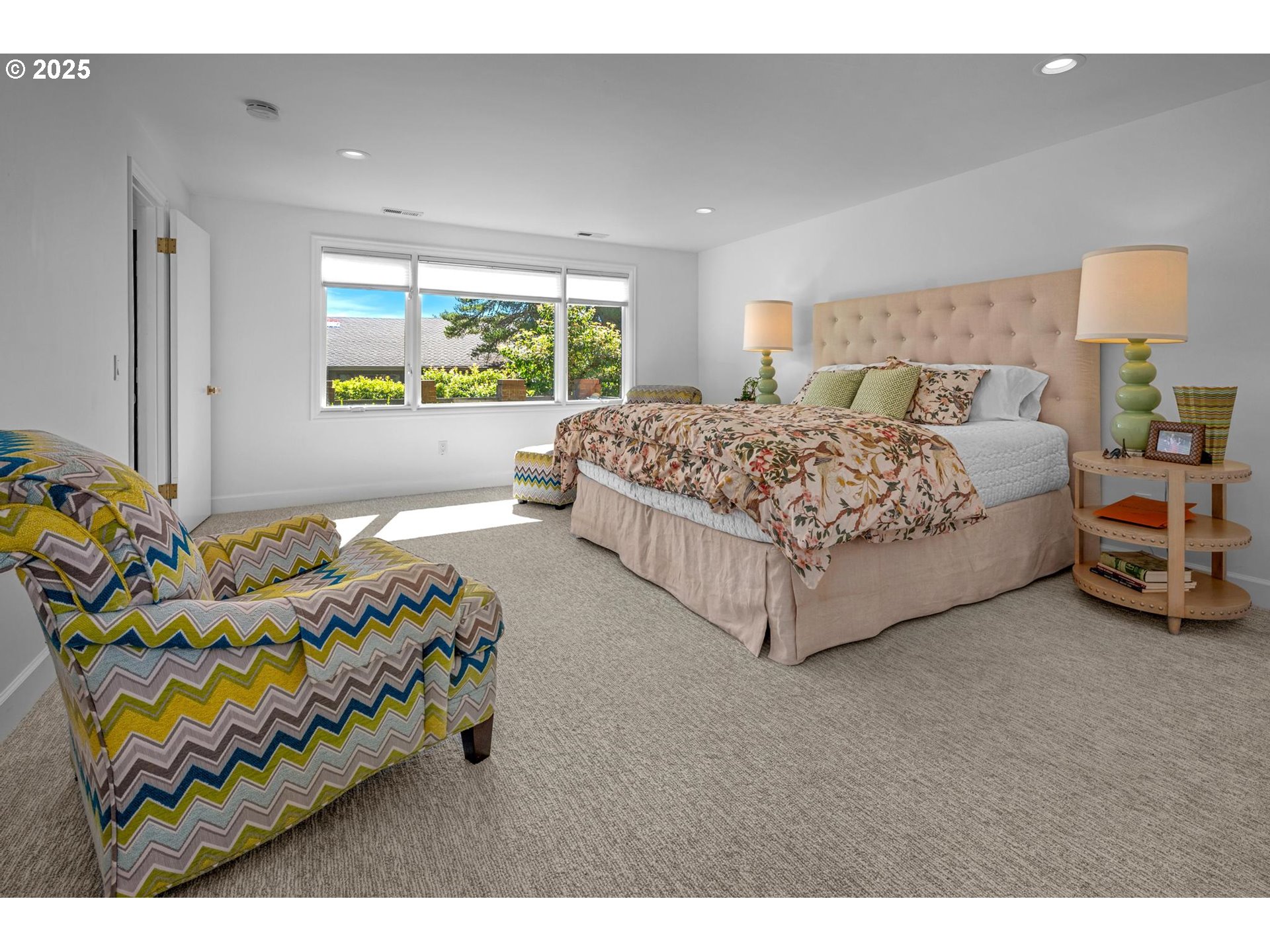40 Southwest Condolea Court Lake Oswego, OR 97035 - Photo 26 of 39 a bedroom with a bed painting on wall and a large window