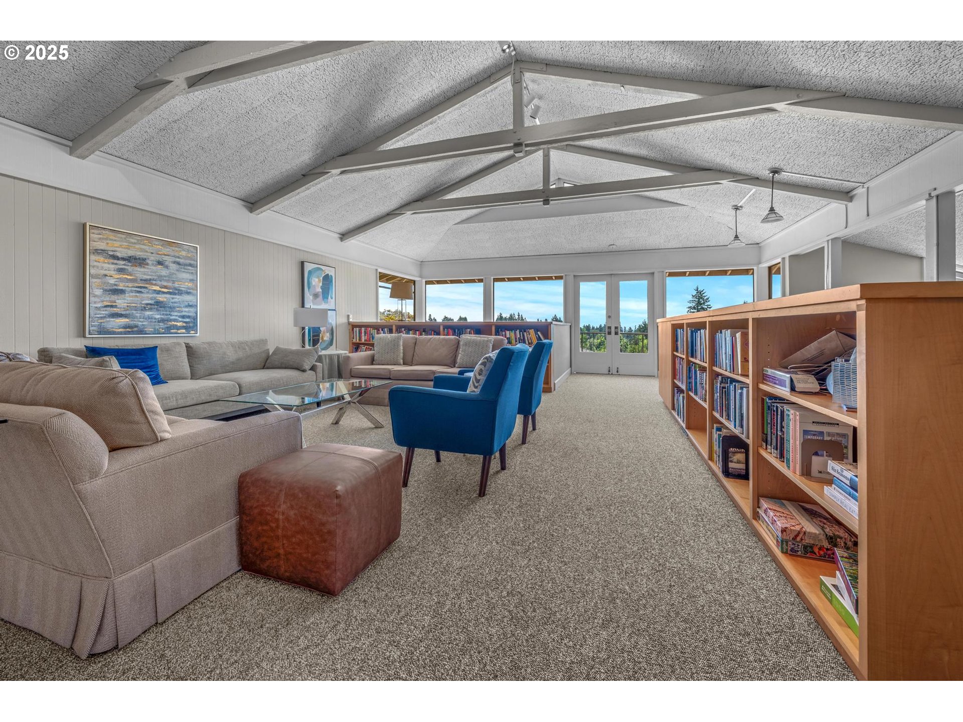 40 Southwest Condolea Court Lake Oswego, OR 97035 - Photo 33 of 39 a living room with furniture and a book shelf