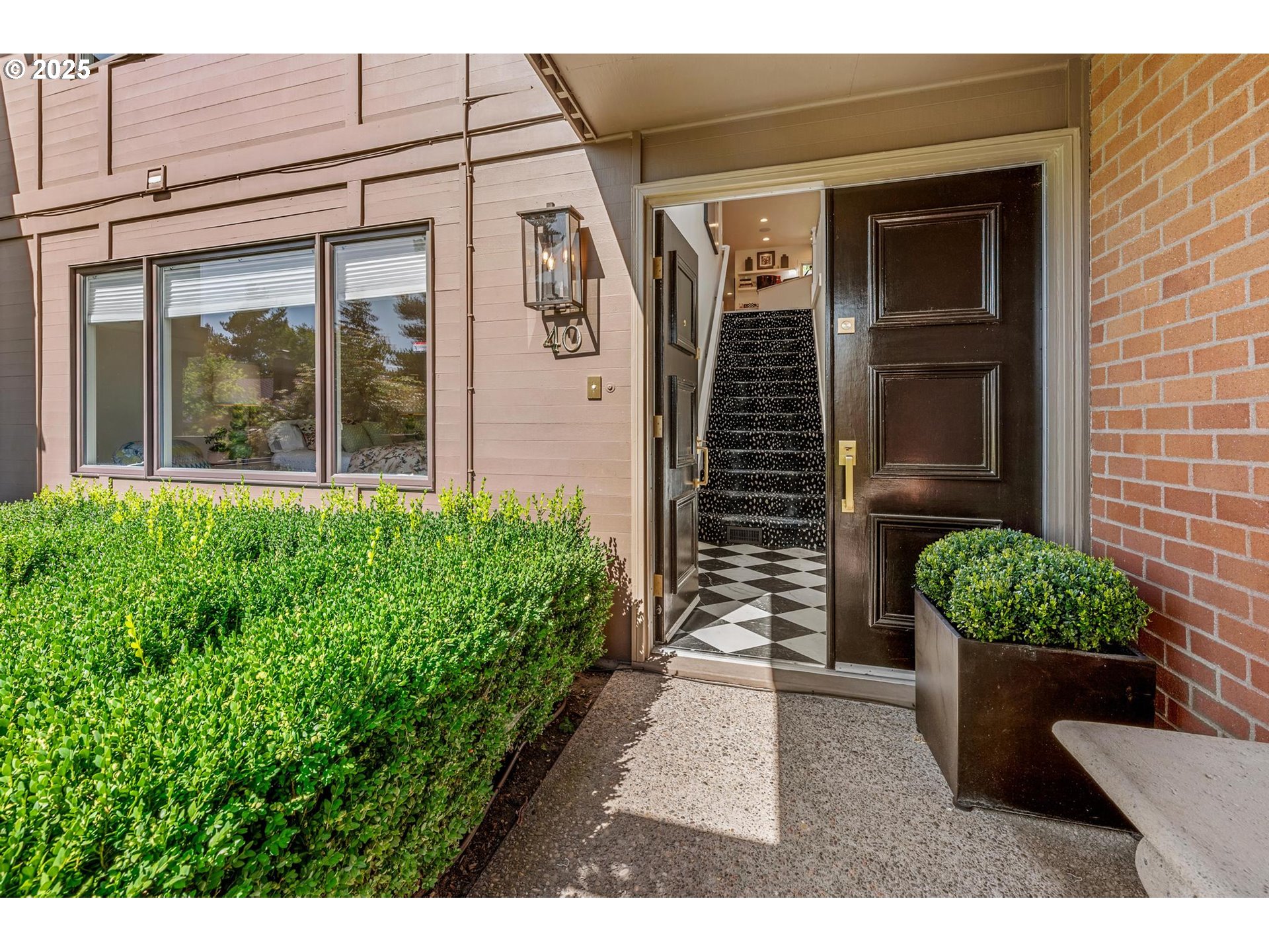 40 Southwest Condolea Court Lake Oswego, OR 97035 - Photo 34 of 39 a view of a front door and a potted plant