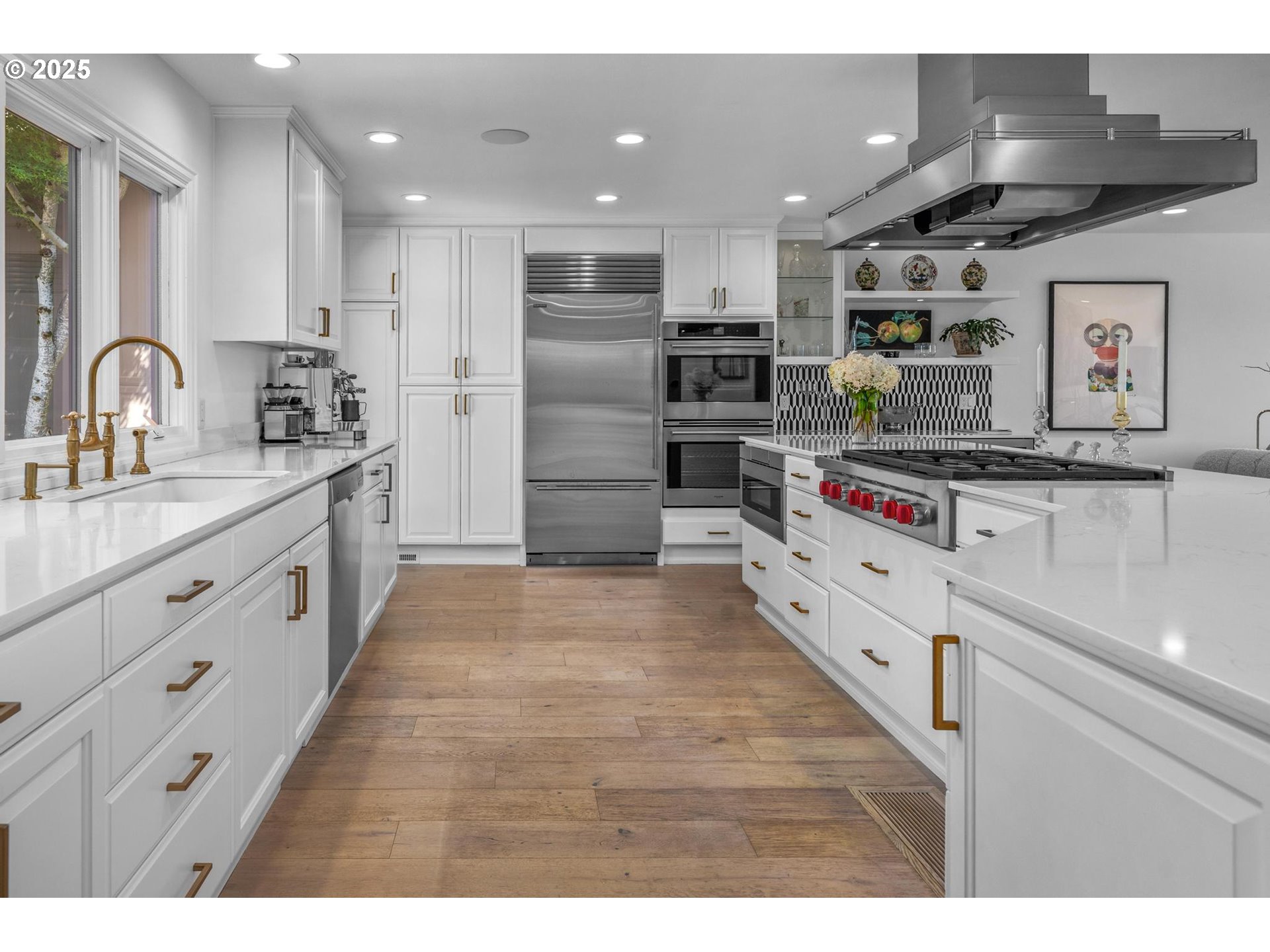 40 Southwest Condolea Court Lake Oswego, OR 97035 - Photo 10 of 39 a kitchen with stainless steel appliances kitchen island granite countertop a stove and a sink