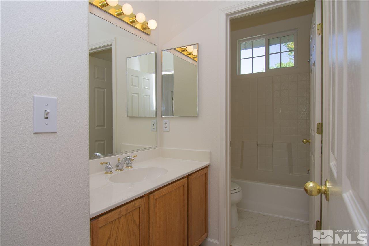 1520 Autumn Reno, NV 89511 - Photo 17 of 25 a bathroom with a sink vanity granite tub and shower