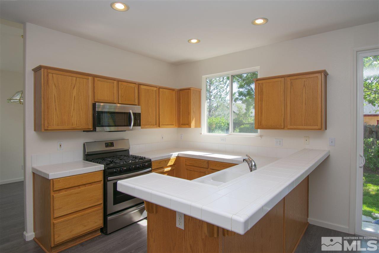 1520 Autumn Reno, NV 89511 - Photo 3 of 25 a kitchen that has a sink and a stove in it