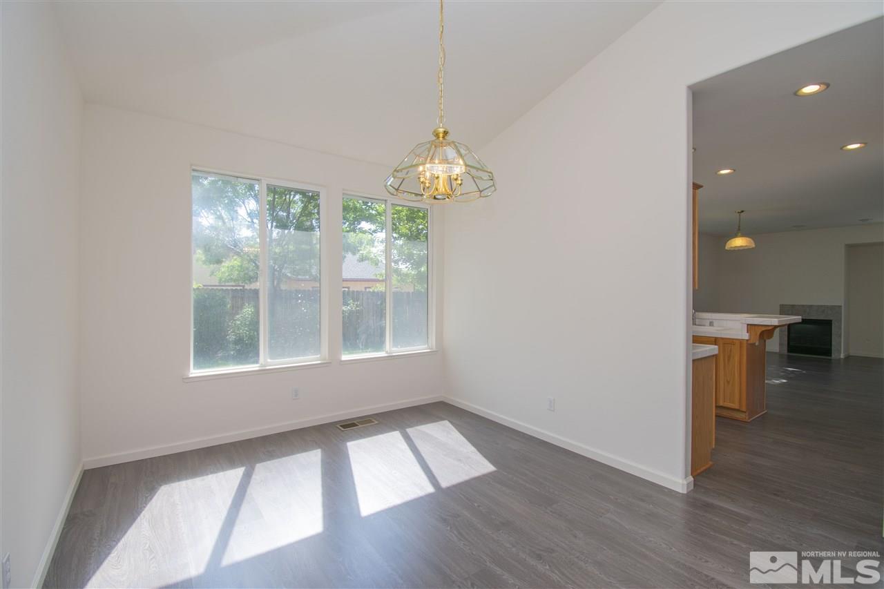 1520 Autumn Reno, NV 89511 - Photo 5 of 25 an empty room with wooden floor and windows