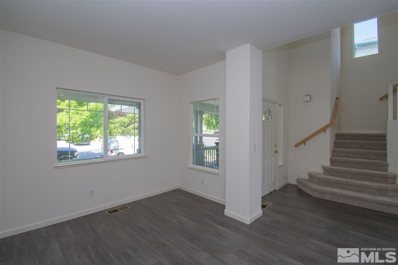 1520 Autumn Reno, NV 89511 - Photo 7 of 25 an empty room with wooden floor and windows