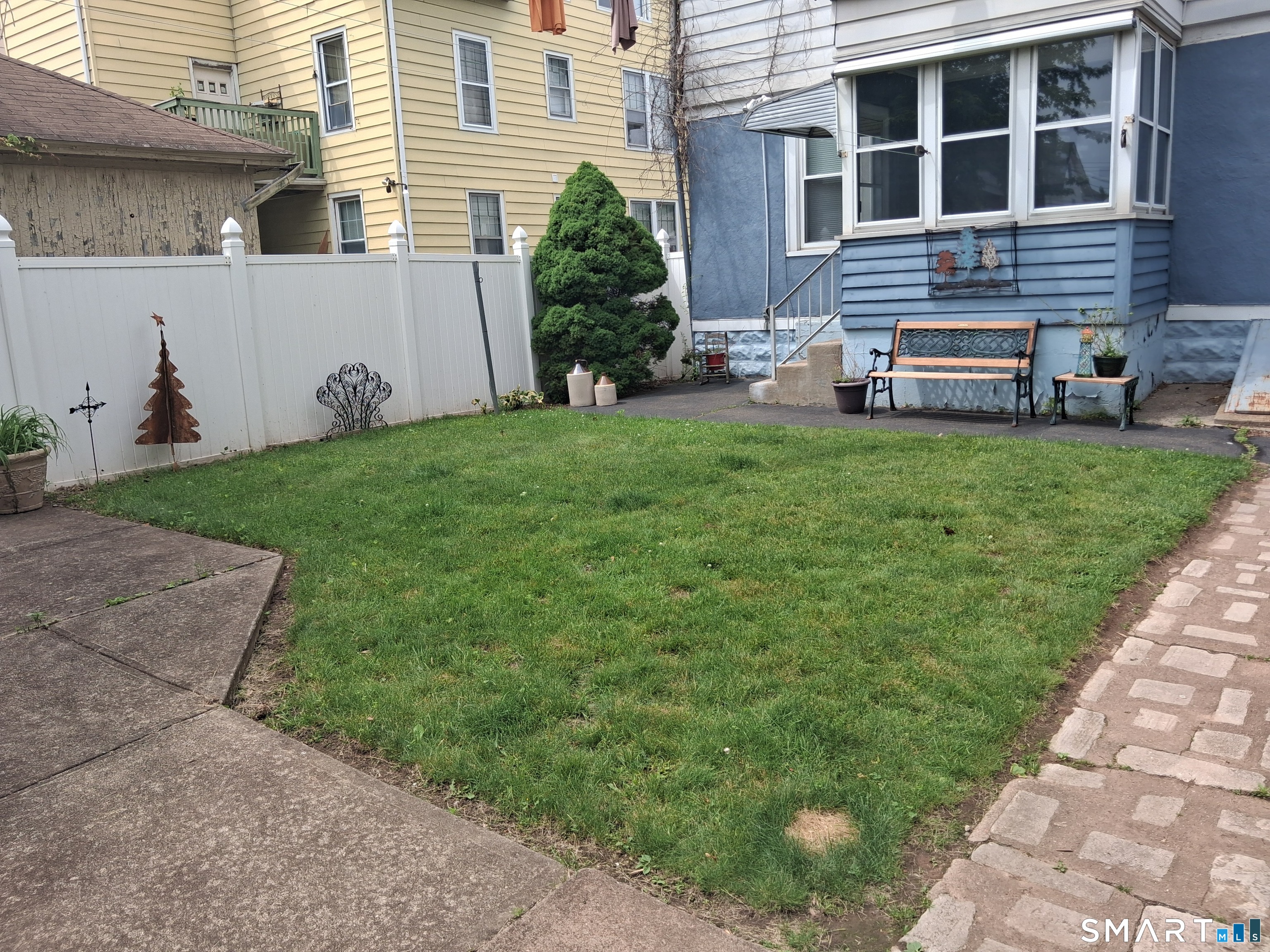 26 4th Street Hamden, CT 06514 - Photo 16 of 40 a front view of a house with a yard