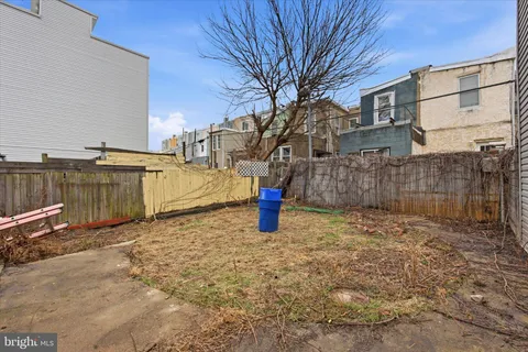 a view of open space with a wooden fence