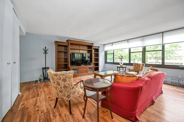 a living room with furniture and a large window