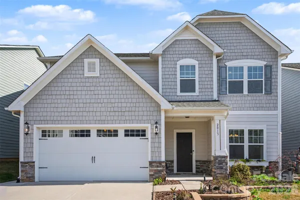 a front view of a house with yard