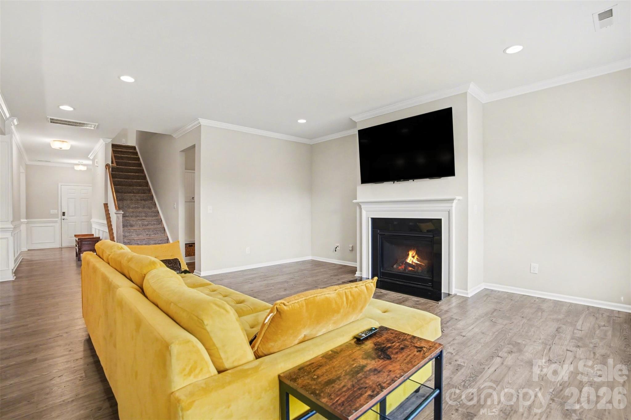 2013 Fuschia Court Tega Cay, SC 29708 - Photo 12 of 47 a living room with furniture flat screen tv and a fireplace