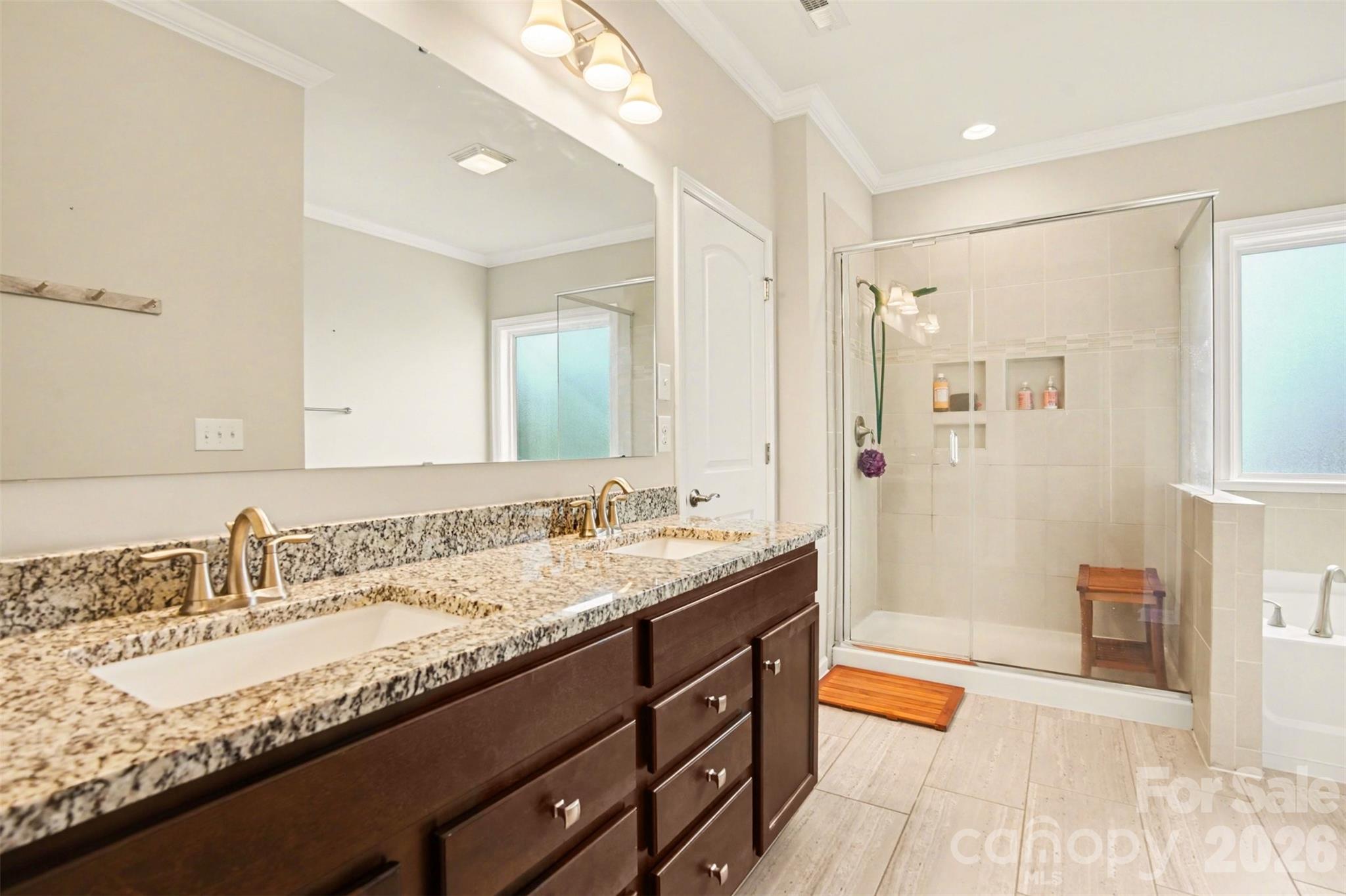 2013 Fuschia Court Tega Cay, SC 29708 - Photo 22 of 47 a bathroom with a granite countertop double vanity sink and a mirror