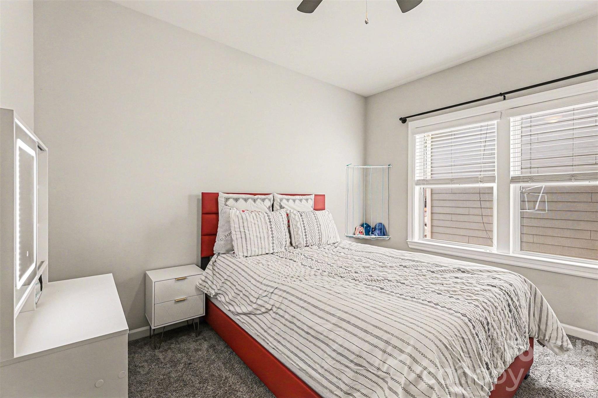 2013 Fuschia Court Tega Cay, SC 29708 - Photo 30 of 47 a bedroom with a bed and a large window