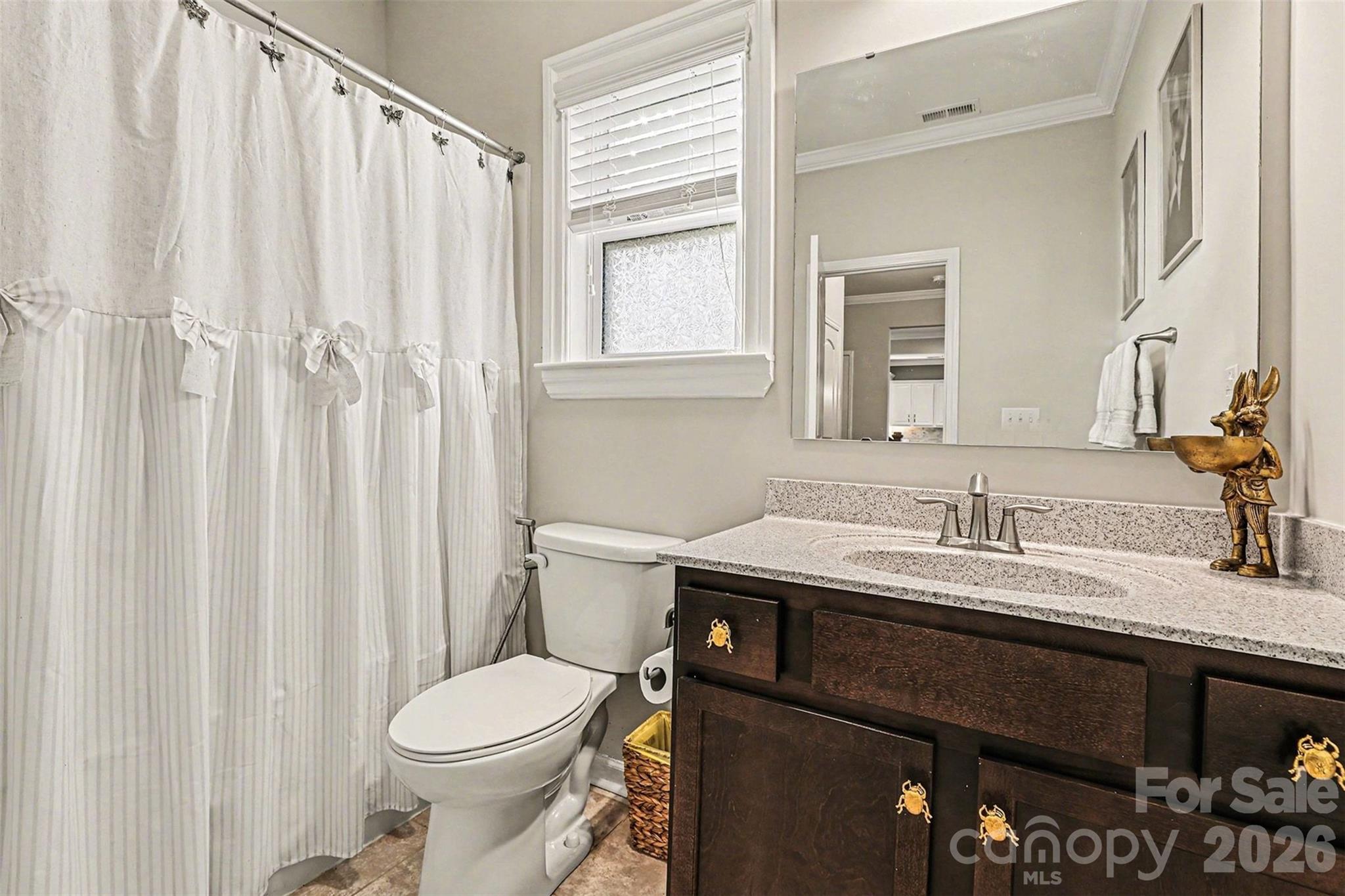 2013 Fuschia Court Tega Cay, SC 29708 - Photo 32 of 47 a bathroom with a sink a toilet and shower