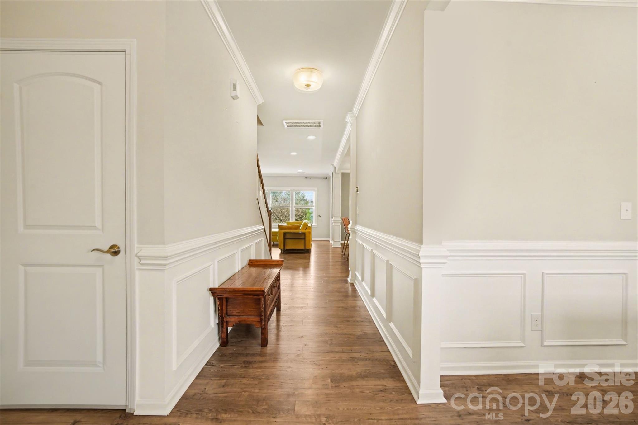 2013 Fuschia Court Tega Cay, SC 29708 - Photo 4 of 47 a view of a hallway with wooden floor and staircase