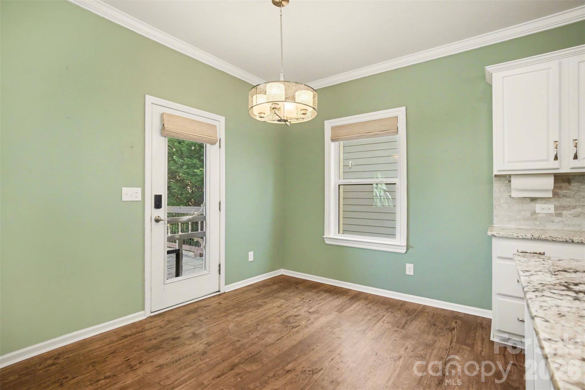 2013 Fuschia Court Tega Cay, SC 29708 - Photo 9 of 47 a view of an empty room with kitchen and a window