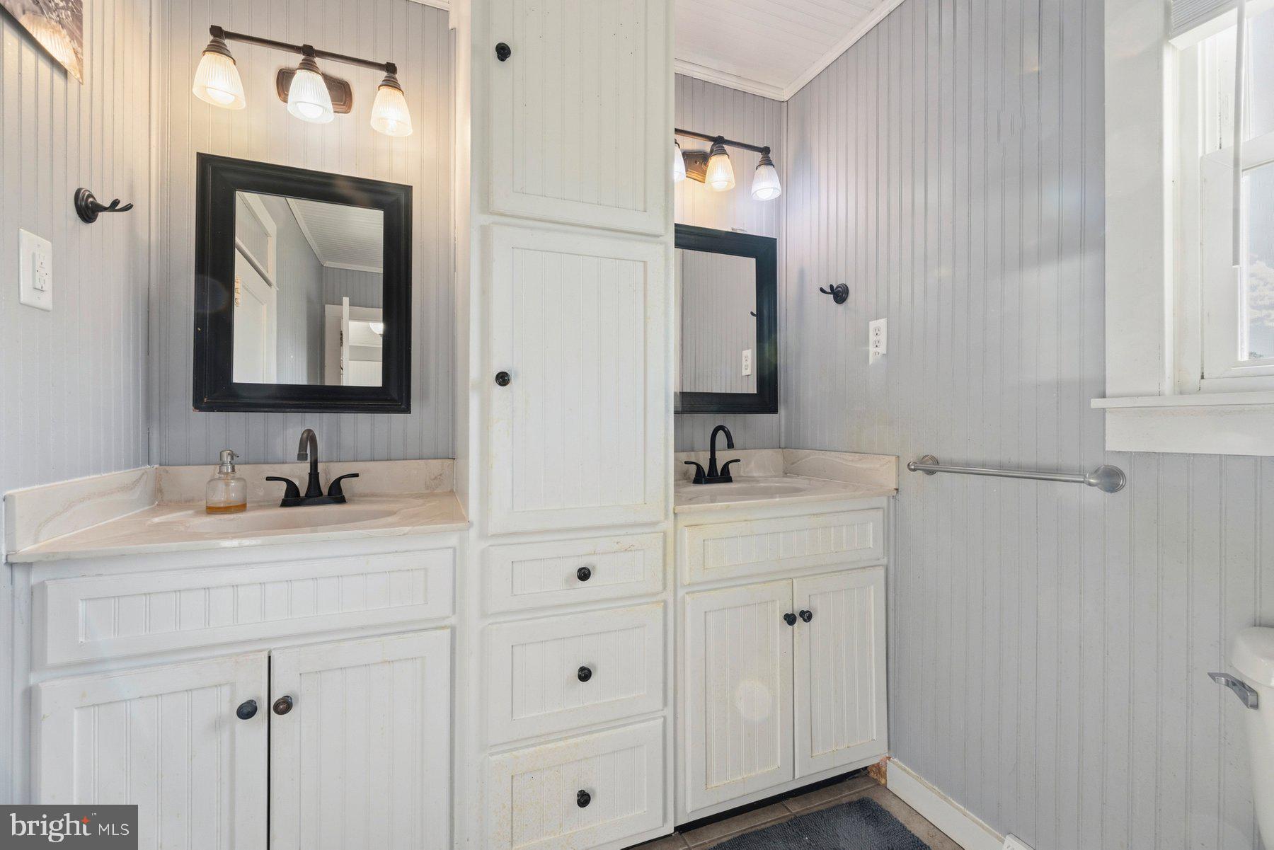 2092 Rocksprings Road Ringgold, VA 24586 - Photo 32 of 86 a bathroom with a sink vanity and mirror