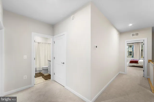 a view of a room with a hallway