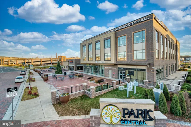 a front view of a house with garden and patio