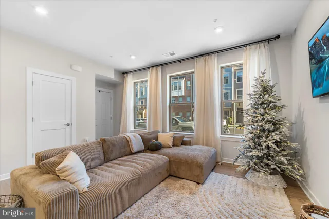 a living room with furniture and a large window