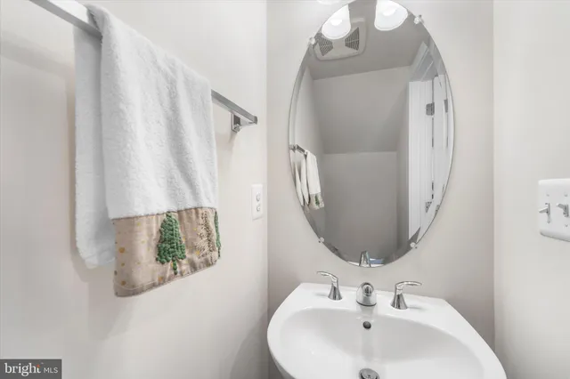 a bathroom with a sink and mirror