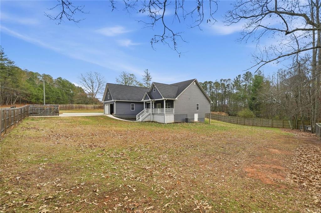 1006 Owens Store Road Canton, GA 30115 - Photo 41 of 48 a house with trees in the background