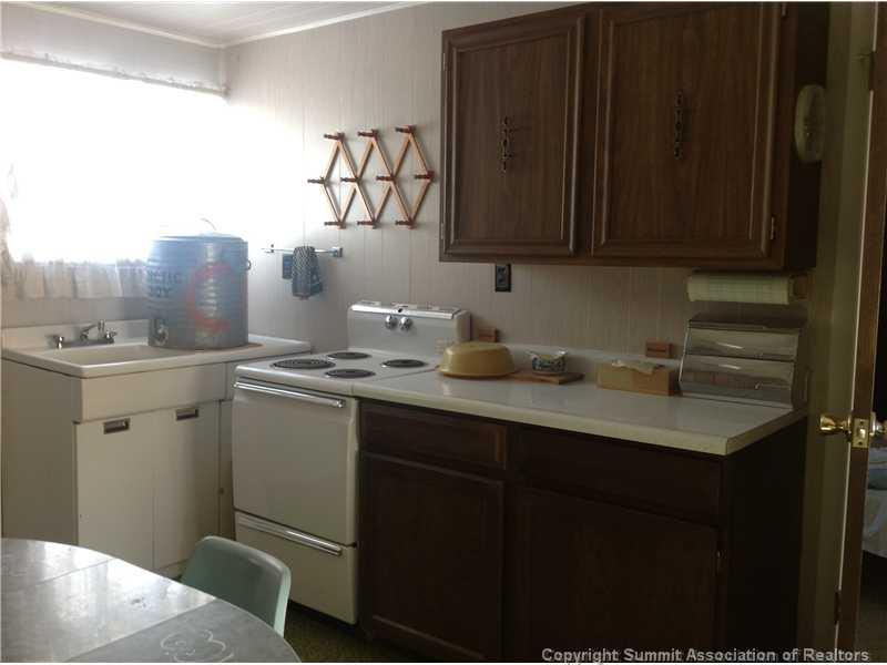 24 F Road Silverthorne, CO 80498 - Photo 4 of 12 a kitchen with stainless steel appliances a sink dishwasher and cabinets with wooden floor