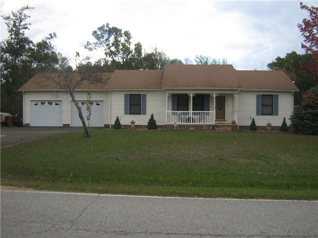 516 Brasfield Road Dresden, TN 38225 - Photo 1 of 14 a front view of a house with a garden