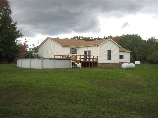 516 Brasfield Road Dresden, TN 38225 - Photo 2 of 14 a view of a house with a yard and a garden