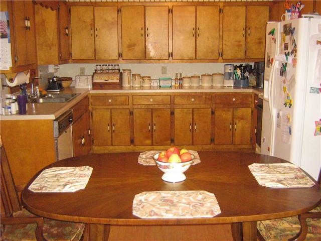 516 Brasfield Road Dresden, TN 38225 - Photo 8 of 14 a view of a dining room with furniture a chandelier and wooden floor