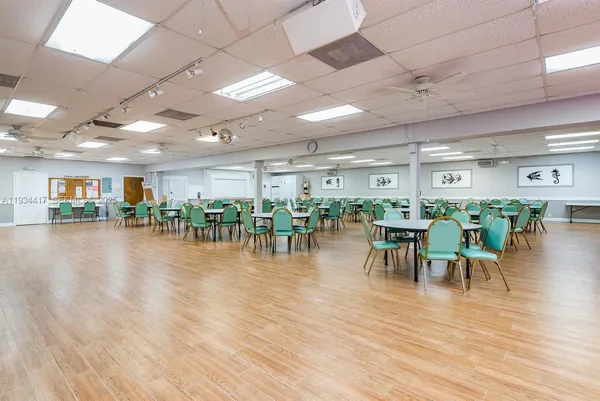 a room with lots of furniture and a wooden floor