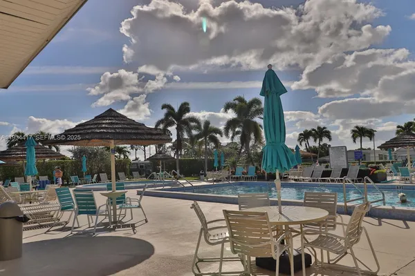 a view of a patio with swimming pool