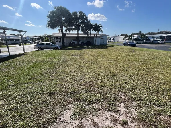 a view of a swimming pool and a chairs
