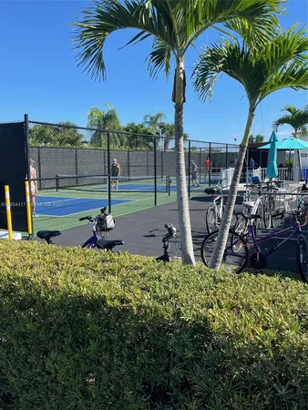 a view of a backyard with swimming pool